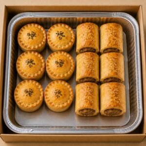 Golden baked mini pies and sausage rolls